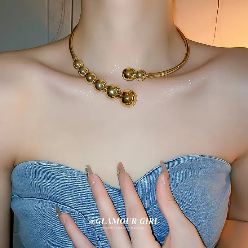 Trendy Gold Sphere Choker Necklace with Bold Design