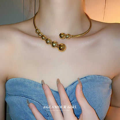 Trendy Gold Sphere Choker Necklace with Bold Design