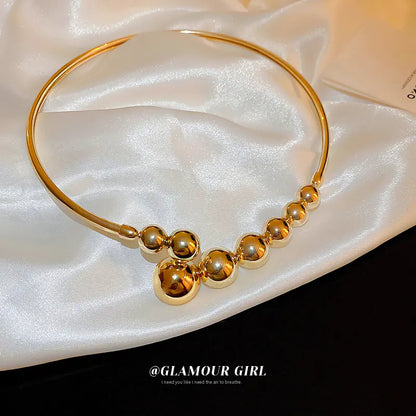 Trendy Gold Sphere Choker Necklace with Bold Design