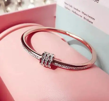 Three Rows of Clay and Diamond Bracelets